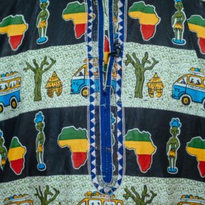 Close-up of vibrant African patterned fabric featuring cultural symbols and colorful designs.